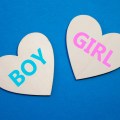 Boy or Girl symbol. Concept word Boy or Girl on wooden hearts. Beautiful blue background. Gender and Boy or Girl concept. Copy&nbsp;space
